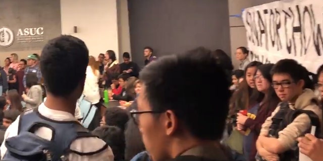 Around 300 people gathered at UC Berkeley's student government meeting to voice opposition or support for Senator Chow.