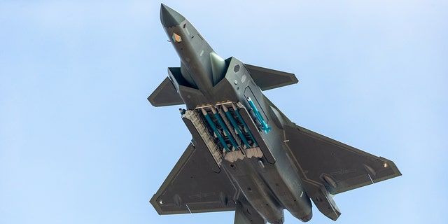 Fighter aircraft J-20 of People's Liberation Army Air Force (PLAAF) performs in the sky showing with live ammunition for the first time on day six of the Airshow China 2018 on November 11, 2018 in Zhuhai, Guangdong Province of China.