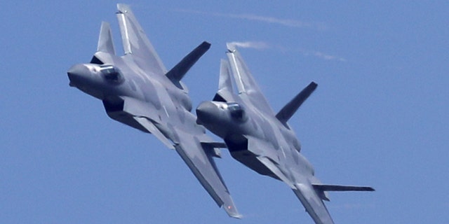 Two J-20 stealth fighters of the Air Force of the Chinese People's Liberation Army (PLA) occur at the 12th International Exhibition on Aviation and Airplanes. Aerospace in China.