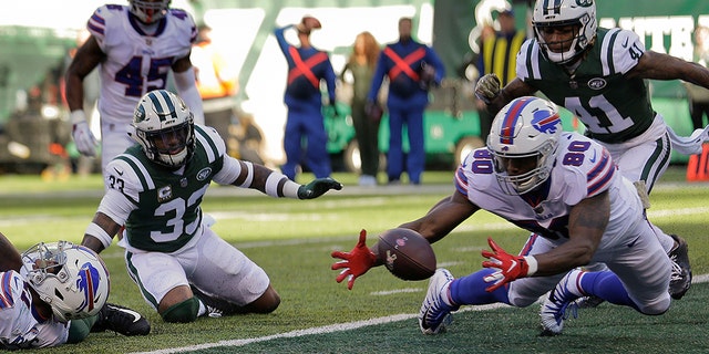 Buffalo Bills tight end Jason Croom (80) recovers a fumble by wide receiver Zay Jones , left, for a touchdown against the New York Jets during the first quarter on Sunday in East Rutherford, N.J.