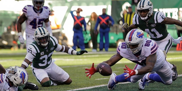 Buffalo Bills tight end Jason Croom (80) recovers a fumble by wide receiver Zay Jones , left, for a touchdown against the New York Jets during the first quarter on Sunday in East Rutherford, N.J.