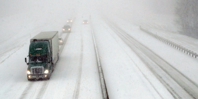 Traffic moves west along I-70 near Lawrence, Kan., Sunday. (AP Photo/Orlin Wagner)