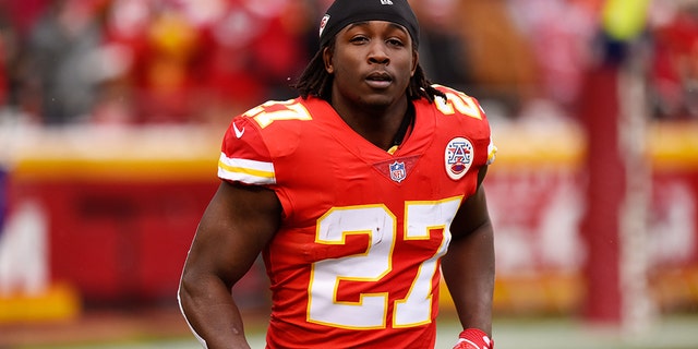 Running back Kareem Hunt, #27 of the Kansas City Chiefs, runs to the sidelines just before kickoff in the game against the Miami Dolphins at Arrowhead Stadium on December 24, 2017 in Kansas City, Missouri.