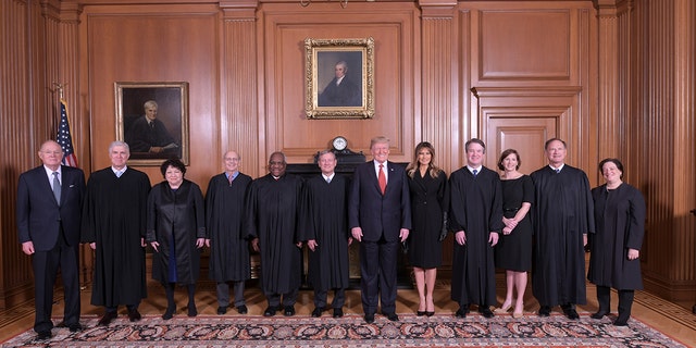 President Trump and Melania Trump pose with members of the Supreme Court, from left to right, retired Justice Anthony M. Kennedy, Associate Justices Neil M. Gorsuch, Sonia Sotomayor, Stephen G. Breyer, Clarence Thomas, Chief Justice John G. Roberts, Jr., Associate Justice Brett M. Kavanaugh, his wife Ashley Kavanaugh, Associate Justices Samuel A. Alito, Jr. and Elena Kagan.