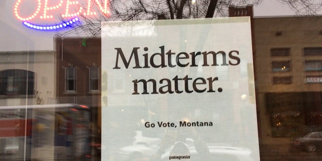 A sign posted on a downtown Bozeman, Mont. coffee shop window reads "Midterms matter. Go Vote, Montana" - it's a Patagonia sign, the outdoor company that's publicly endorsed Tester.