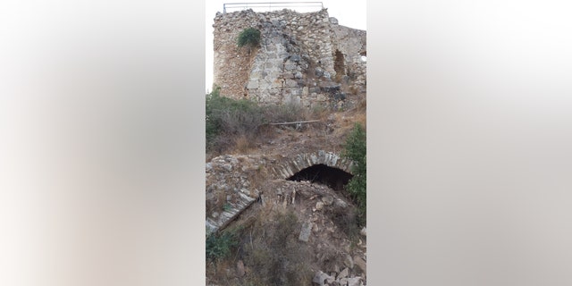 The Gothic hall once stood above this collapsed portion of Montfort Castle.