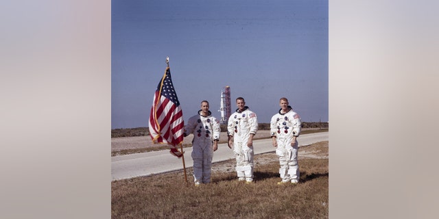 Apollo 9 astronauts, left to right, James McDivitt, David Scott, and Russell Schweickart, stand in front of the Apollo/Saturn V space vehicle that would launch the Apollo 8 crew. The launch of the Apollo 9 (Saturn V launch vehicle, SA-504) took place on March 3, 1969. (NASA)