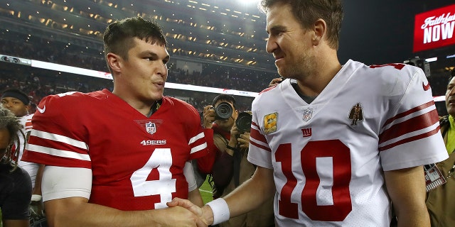 San Francisco 49ers quarterback Nick Mullens (4) shakes hands with New York Giants quarterback Eli Manning (10) after an NFL football game in Santa Clara, Calif., Monday, Nov. 12, 2018.
