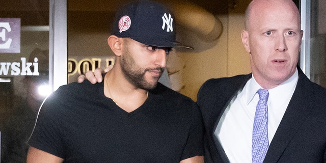 Nauman Hussain, left, operator of a limousine company that owned the vehicle involved in a crash that killed 20 people in upstate New York, leaves with his lawyer Lee Kindlon after posting bond at Cobleskill Town Court in Cobleskill, N.Y., Oct. 10, 2018. (Reuters)