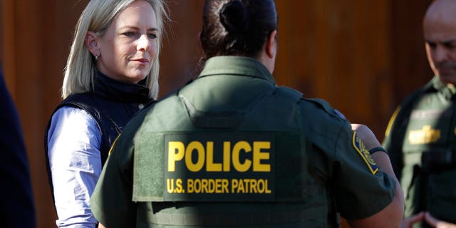 U.S. Department of Homeland Security Secretary Kirstjen Nielsen, left, speaks with Border Patrol agents near a newly fortified border wall structure in Calexico, Calif. (AP Photo/Gregory Bull)
