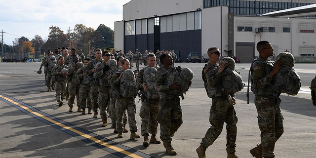 Soldiers from the 591st Military Police Company board a Super Hercules C-130J from Dyess Air Force Base in Texas on Wednesday.