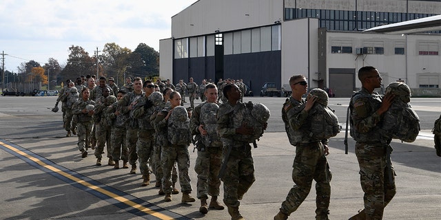 Soldiers from the 591st Military Police Company boarding a C-130J Super Hercules from Dyess Air Force Base, Texas, on Wednesday.