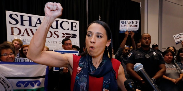 Democrat house candidate Sharice Davids reacts as she gives a victory speech to supporters at a victory party in Olathe, Kansas.