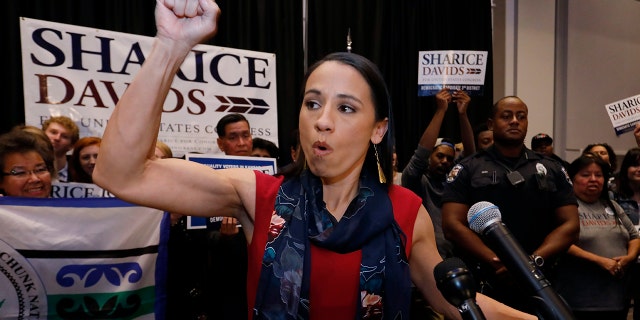 Democrat house candidate Sharice Davids reacts as she gives a victory speech to supporters at a victory party in Olathe, Kansas.