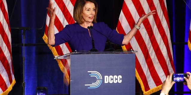 House Minority Leader Nancy Pelosi of Calif., smiles as she is cheered by a crowd of Democratic supporters during an election night returns event at the Hyatt Regency Hotel, on Tuesday, Nov. 6, 2018, in Washington. (AP Photo/Jacquelyn Martin)