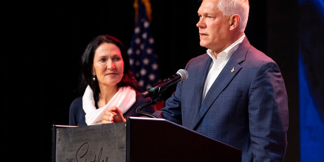 Incumbent U.S. Rep Pete Sessions, R-Texas, is joined by his wife on stage as he conceded the U.S. House race to Democratic challenger and first-time candidate Colin Allred. (AP Photo/Jeffrey McWhorter)