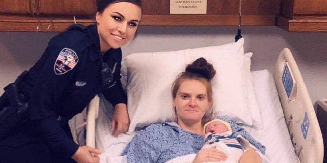 Dickson Police Officer Sierra Reprogal poses with Brigette Crumley and her newborn daughter, named after the officer who helped deliver her.
