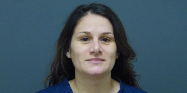 Samantha Baxter, 38, is accused of driving into a liquor store in Muskegeon Heights, Michigan, and seriously injuring a customer inside.