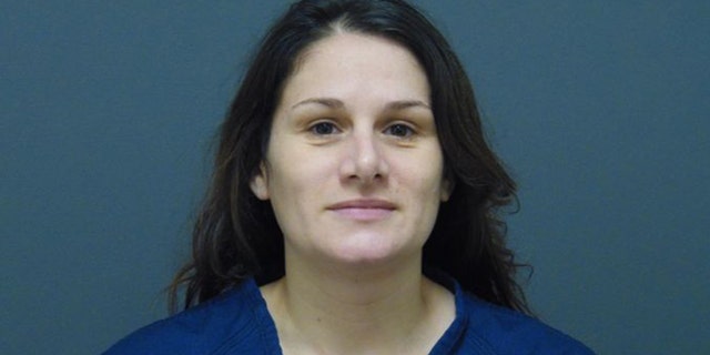 Samantha Baxter, 38, is accused of driving into a liquor store in Muskegeon Heights, Michigan, and seriously injuring a customer inside.
