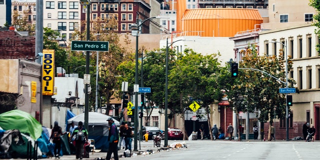 Los Angeles prosecutors say a voter fraud scheme has been uncovered in which homeless on Skid Row were being offered cash and cigarettes in exchange for their signatures.