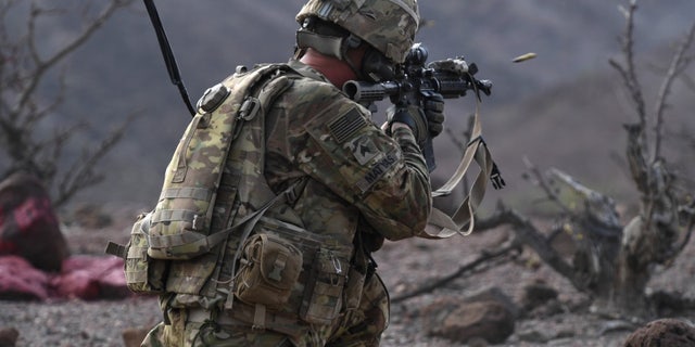 A 10th Mountain Division soldier fires his weapon during a training exercise in Arta, Djibouti, on Aug. 25, 2018.