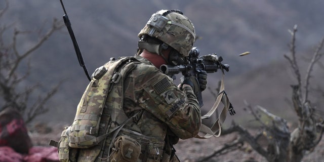 File photo - A 10th Mountain Division Soldier fires an M4 rifle during a platoon Situational Training Exercise at a range in Arta, Djibouti, Aug. 25, 2018.