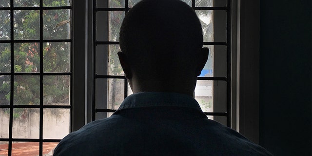 A gay man with HIV stands in a clinic in Dar es Salaam, Tanzania in this 2016 photo.