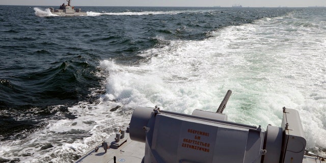 In this file photo taken and distributed by Ukrainian Navy Press Service on Sunday, Nov. 25, 2018, two Ukrainian forces navy ships are seen near Crimea. The Ukrainian navy says a Russian coast guard vessel rammed a Ukrainian navy tugboat near Crimea, damaging the ship's engines and hull. (Ukrainian Navy Press Service via AP)