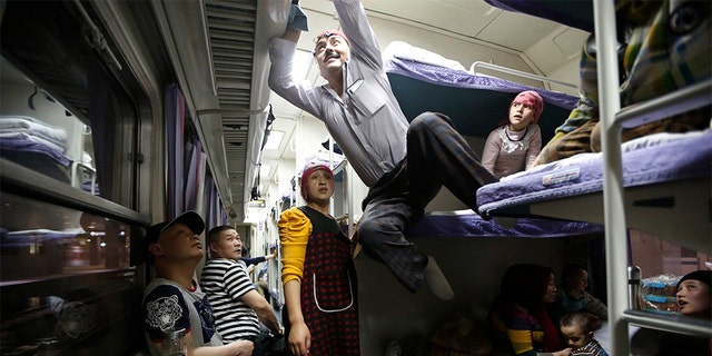A Uighur group traveling on a train to Xingjiang, in Shanghai, May 14, 2014. (REUTERS/Aly Song, File)