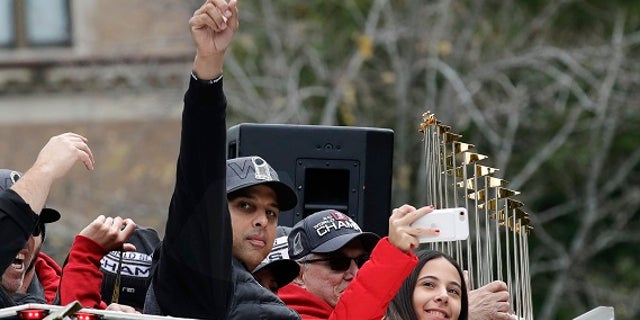 The World Series trophy was also pelted with a beer can.