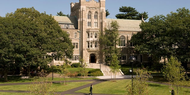 Officials say a 100-year-old oak tree will be removed during a planned renovation of Harvard Divinity School’s Andover Hall.