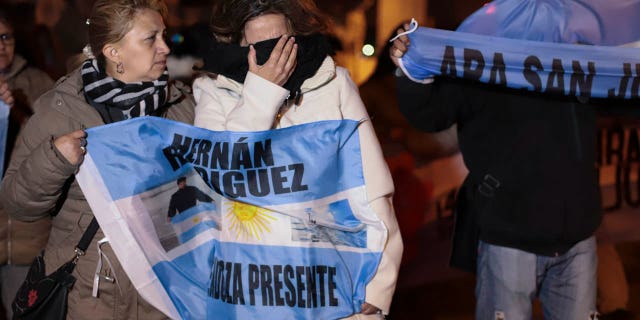 Relatives of the crew of the ARA San Juan submarine embrace outside the navy base in Mar del Plata, Argentina, Saturday, Nov. 17, 2018. Argentina's navy announced early Saturday, that they have located the missing submarine ARA San Juan in the Atlantic a year after it disappeared with 44 crew members aboard.