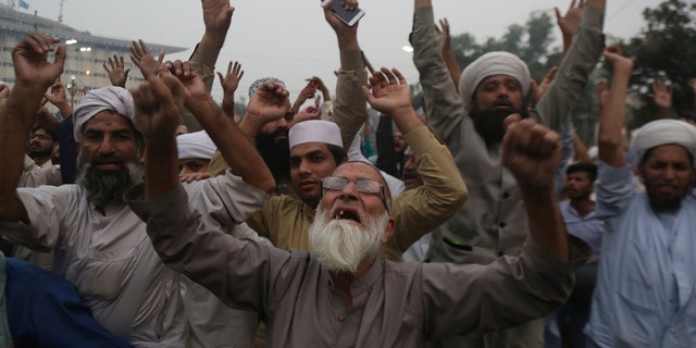 Protesters shout slogans during a rally to condemn a Supreme Court decision that acquitted Asia Bibi, a Christian woman, who spent eight years on death row accused of blasphemy, in Lahore, Pakistan, Friday, Nov. 2, 2018.