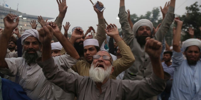 Protesters shout slogans during a rally to condemn a Supreme Court decision that acquitted Asia Bibi, a Christian woman, who spent eight years on death row accused of blasphemy, in Lahore, Pakistan, Friday, Nov. 2, 2018.