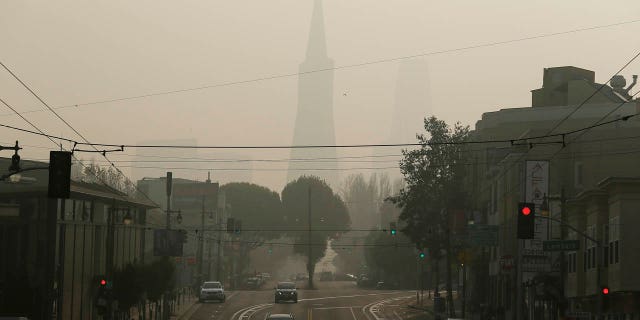 The Transamerica Pyramid is obscured by smoke and haze from wildfires Friday, Nov. 16, 2018, in San Francisco.