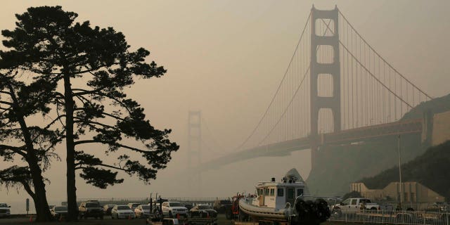 The Golden Gate Bridge is obscured by smoke and haze from wildfires Friday, Nov. 16, 2018, in this view from Fort Baker near Sausalito, Calif.