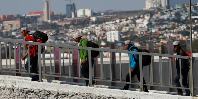 Central American migrants arrive in Queretaro, Mexico, as they resume their journey north after leaving the temporary shelter in Mexico City, Saturday, Nov. 10, 2018.