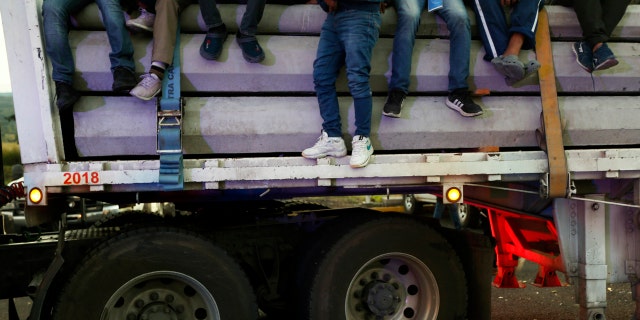 Central American migrants moving as a caravan toward the U.S. border get a free ride on a truck at Ixtlán del Rio, Nayarit, Mexico, Tuesday, Nov. 13, 2018.