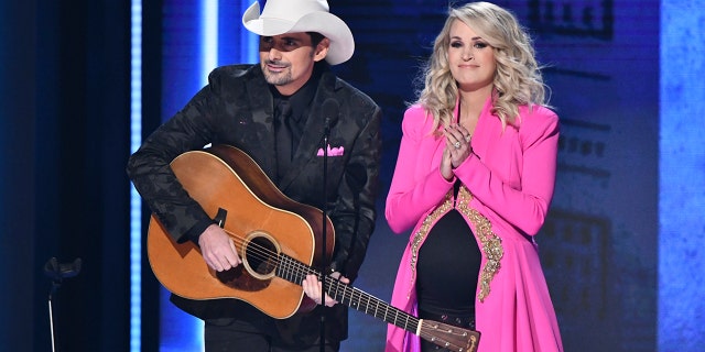 Hosts Brad Paisley, left, and Carrie Underwood appear at the 52nd annual CMA Awards at Bridgestone Arena on Wednesday, Nov. 14, 2018, in Nashville, Tenn.