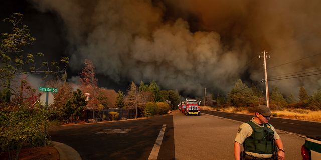 The Camp Fire rages through Paradise, Calif., on Thursday, Nov. 8, 2018. Tens of thousands of people fled a fast-moving wildfire Thursday in Northern California, some clutching babies and pets as they abandoned vehicles and struck out on foot ahead of the flames that forced the evacuation of an entire town. (AP Photo/Noah Berger)
