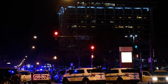 Chicago Police work the scene where a gunman opened fire at Mercy Hospital, Monday, Nov. 19, 2018, in Chicago.