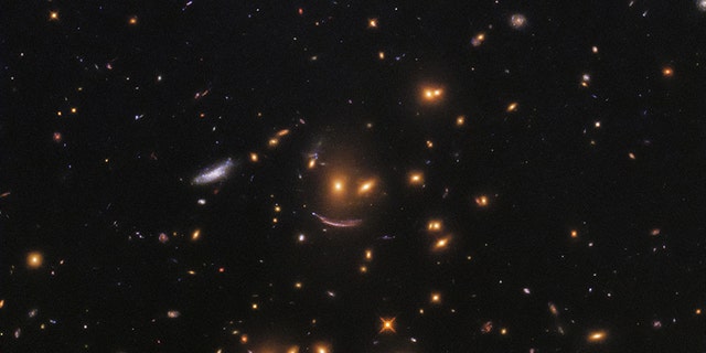 NASA recently shared a photo taken by the Hubble Space Telescope that shows a formation of galaxies forming what looks like a smiley face.<br data-cke-eol="1">