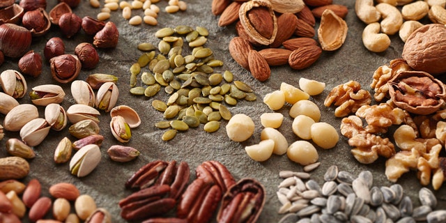 A variety of healthy and organic nuts and seeds are shown here. Try swapping fish for various nuts and seeds such as flax, chia, hemp, sesame, sunflower and pumpkin seeds, as well as almonds and walnuts, said Kapur.