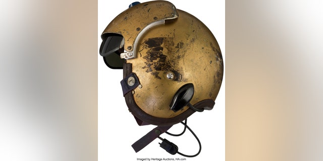 This undated photo provided by Heritage Auctions shows a helmet worn by John Glenn during the history-making flight, dubbed Project Bullet, in which the future astronaut set the transcontinental speed record in 1957. Artifacts owned by the late Neil Armstrong will be offered for sale by Dallas-based Heritage Auctions starting Thursday, Nov. 1, 2018, including pieces of a wing and propeller from the 1903 Wright Flyer the astronaut took with him to the moon in 1969. (Courtesy of Heritage Auctions via AP)