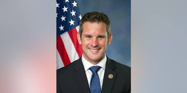 At a time when most people are wrapping up their day, Illinois Congressman Adam Kinzinger is headed to work. He is not going to the office in Washington D.C., but out past a hangar toward a plane, an RC-26 surveillance aircraft.