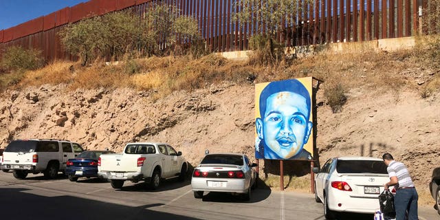 The boundary in Nogales, Mexico where a poster of Jose Antonio Elena Rodriguez hangs.