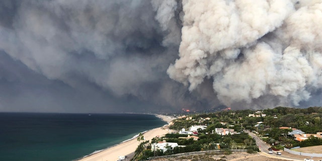 In this Friday, Nov. 9, 2018 photo, smoke from the wildires fills the air in Malibu, Calif.