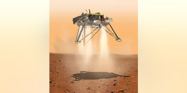This illustration made available by NASA in October 2016 shows an illustration of NASA's InSight lander about to land on the surface of Mars. NASA's InSight spacecraft will enter the Martian atmosphere at supersonic speed, then hit the brakes to get to a soft, safe landing on the alien red plains. After micromanaging every step of the way, flight controllers will be powerless over what happens at the end of the road, nearly 100 million miles away. (NASA/JPL-Caltech via AP