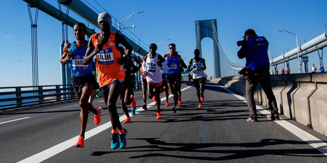 Elite men runners cross the Verrazano-Narrows Bridge during the New York City Marathon on Sunday, Nov. 4, 2018, in New York.