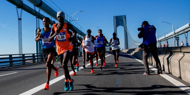 Elite men runners cross the Verrazano-Narrows Bridge during the New York City Marathon on Sunday, Nov. 4, 2018, in New York.